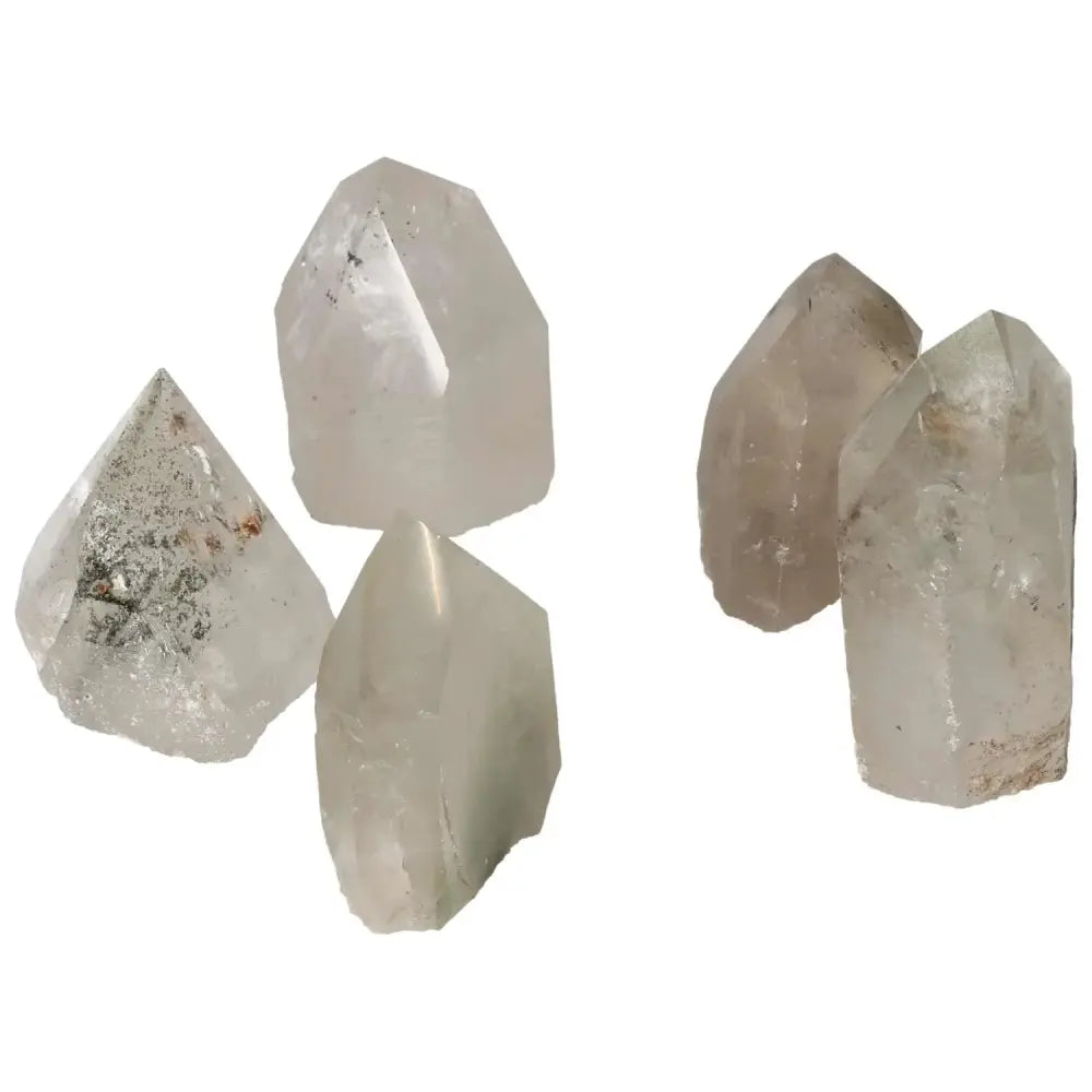 Polished clear quartz crystals with chlorite inclusions, ideal for spiritual harmony and purification by Sylvia Crystals.