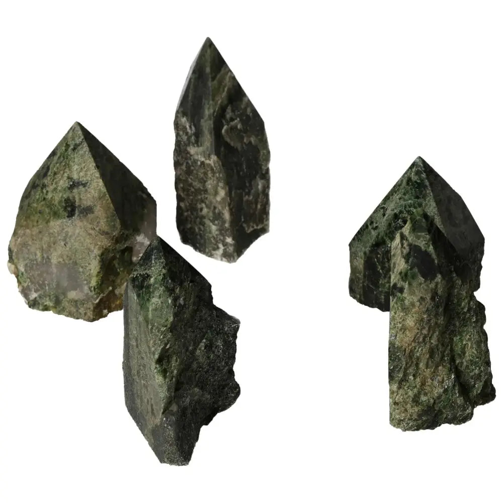 Four polished Diopside crystal points showcasing rich green hues and natural textures, ideal for crystal enthusiasts.