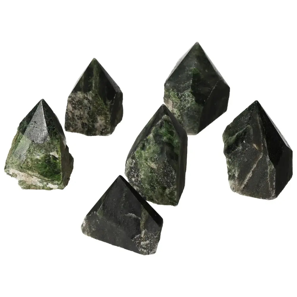 Vibrant green polished point diopside gemstones from Sylvia Crystals, enhancing creativity and emotional balance.