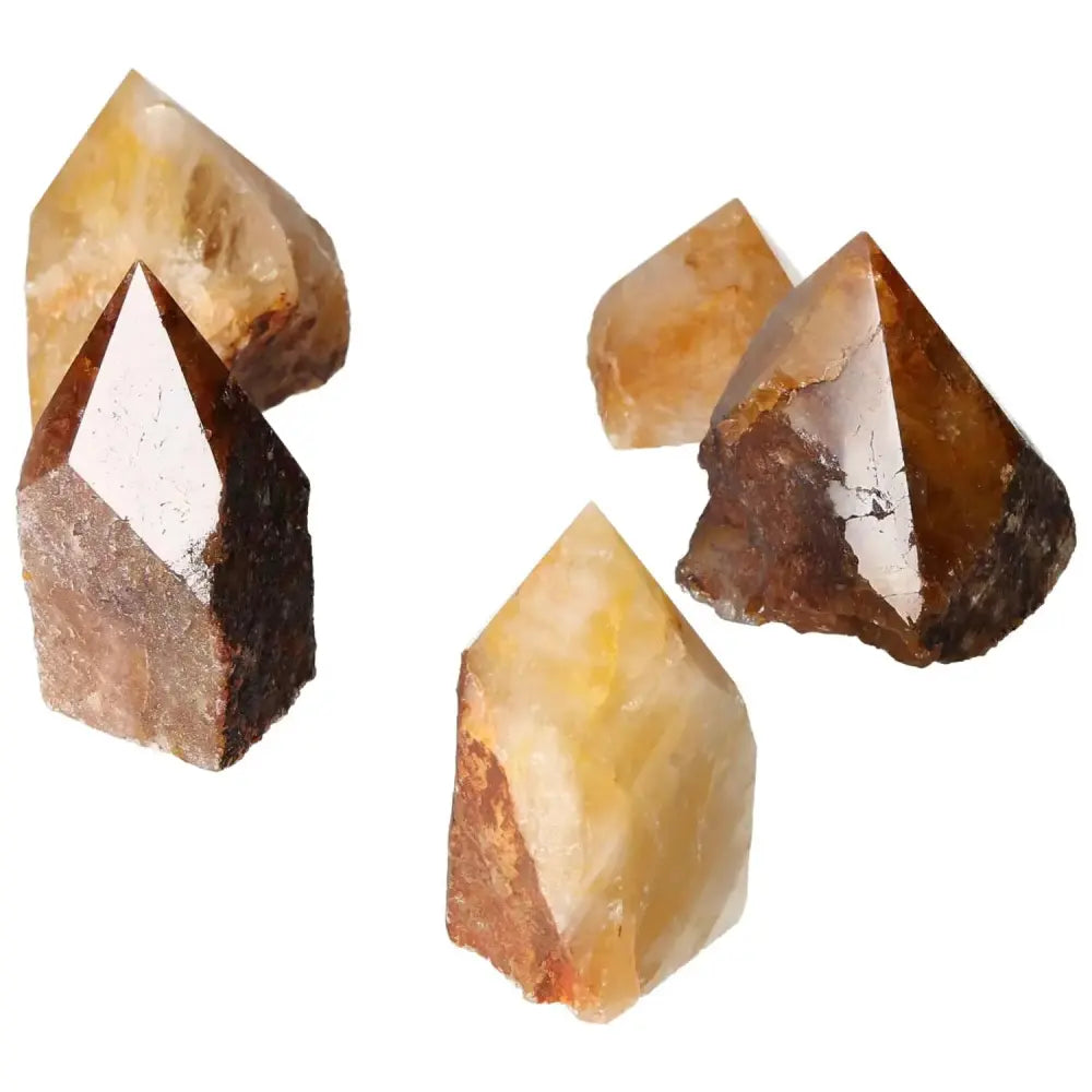 Polished Point Hematoide M crystals showcasing their unique brown and yellow hues, ideal for spiritual practice and enhancing living spaces.
