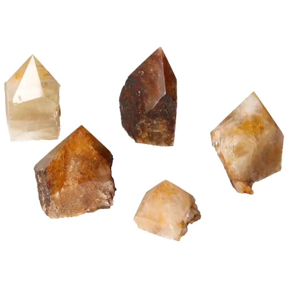 Five polished Hematoide crystal points showcasing unique coloration and clarity, perfect for spiritual practice or home decor by Sylvia Crystals.