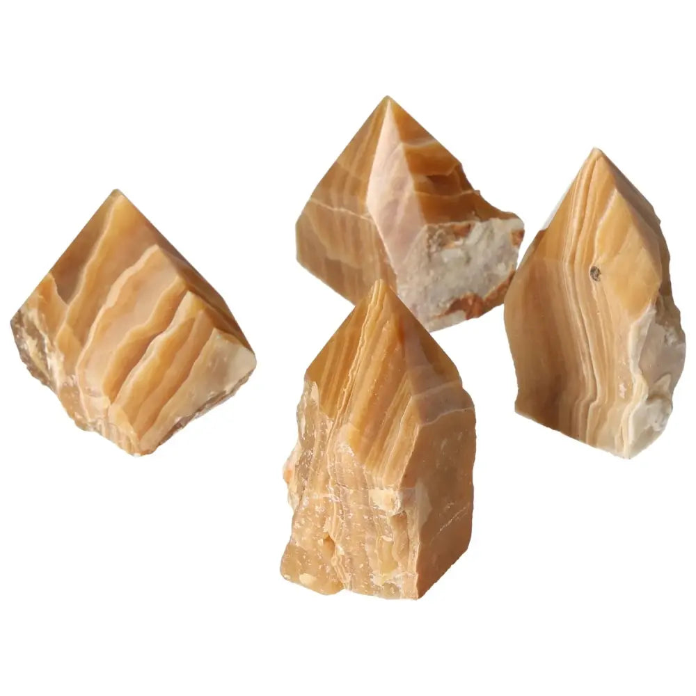 Polished Point Honey Calcite M crystals radiating golden warmth known for energy, prosperity, and success, offered by Sylvia Crystals.