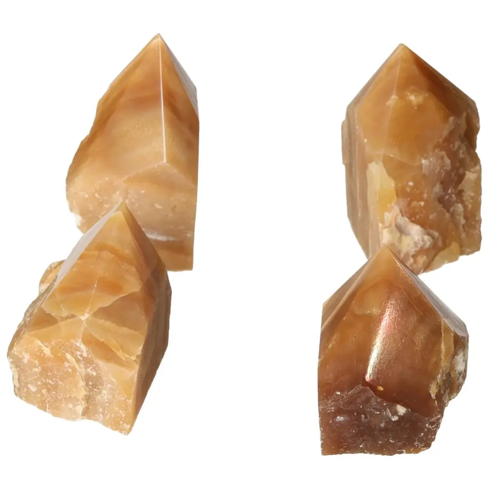 Polished Point Honey Calcite M crystals, highlighted by warm golden hues, perfect for manifestation and attracting abundance.