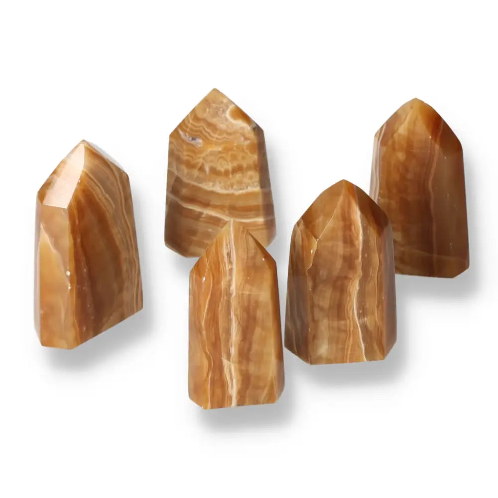 Polished Point Honey Calcite M crystals, showcasing rich honey hues; perfect for attracting prosperity and emotional healing from Sylvia Crystals.
