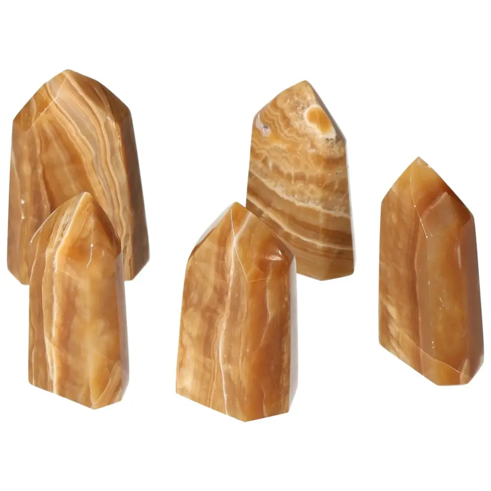 Polished Point Honey Calcite M crystals from Sylvia Crystals in rich honey hues, symbolizing prosperity and emotional healing.