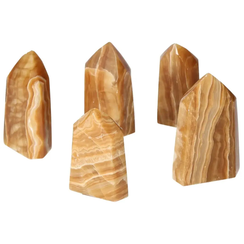 Polished Point Honey Calcite M crystals showcasing rich honey hues, symbolizing prosperity and positivity from Sylvia Crystals.