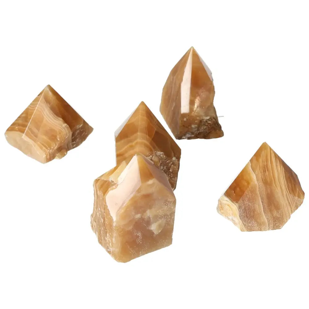 Polished Point Honey Calcite S crystals symbolizing prosperity and abundance, known for uplifting mood and assisting in manifestation.