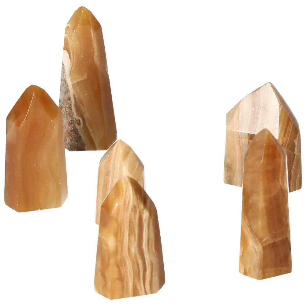 Polished Point Honey Calcite S crystals from Sylvia Crystals, symbolizing prosperity and positive transformation.