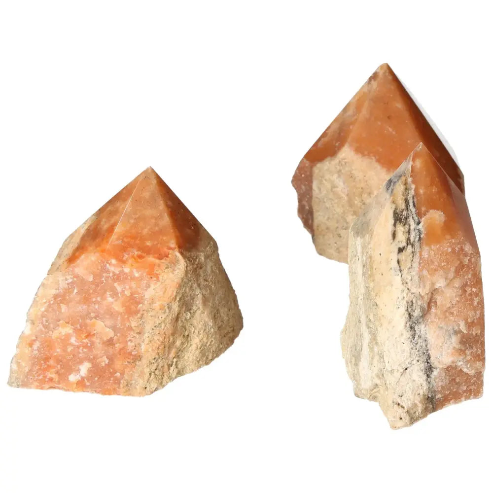 Polished Point Orange Calcite Bi-Color crystals featuring vibrant hues and unique design, from Sylvia Crystals collection. Energizing decor.