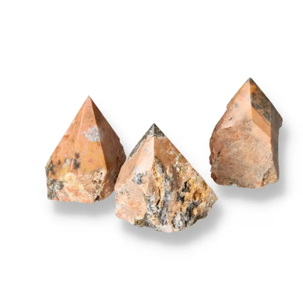 Polished Point Orquidea Calcite L gemstones from Sylvia Crystals, showcasing natural elegance and transformative beauty.