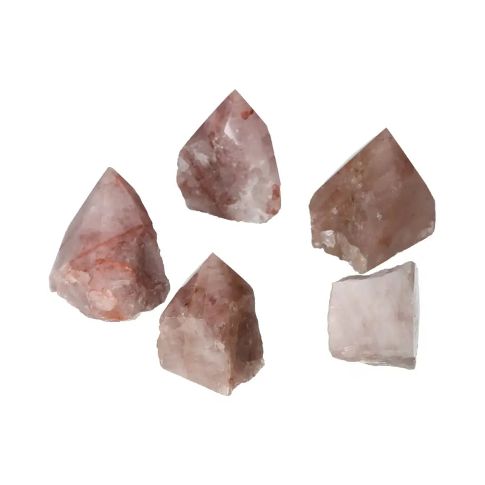 Collection of polished point Pink Hematoide S gemstones showcasing luxurious pink tones and natural beauty by Sylvia Crystals.