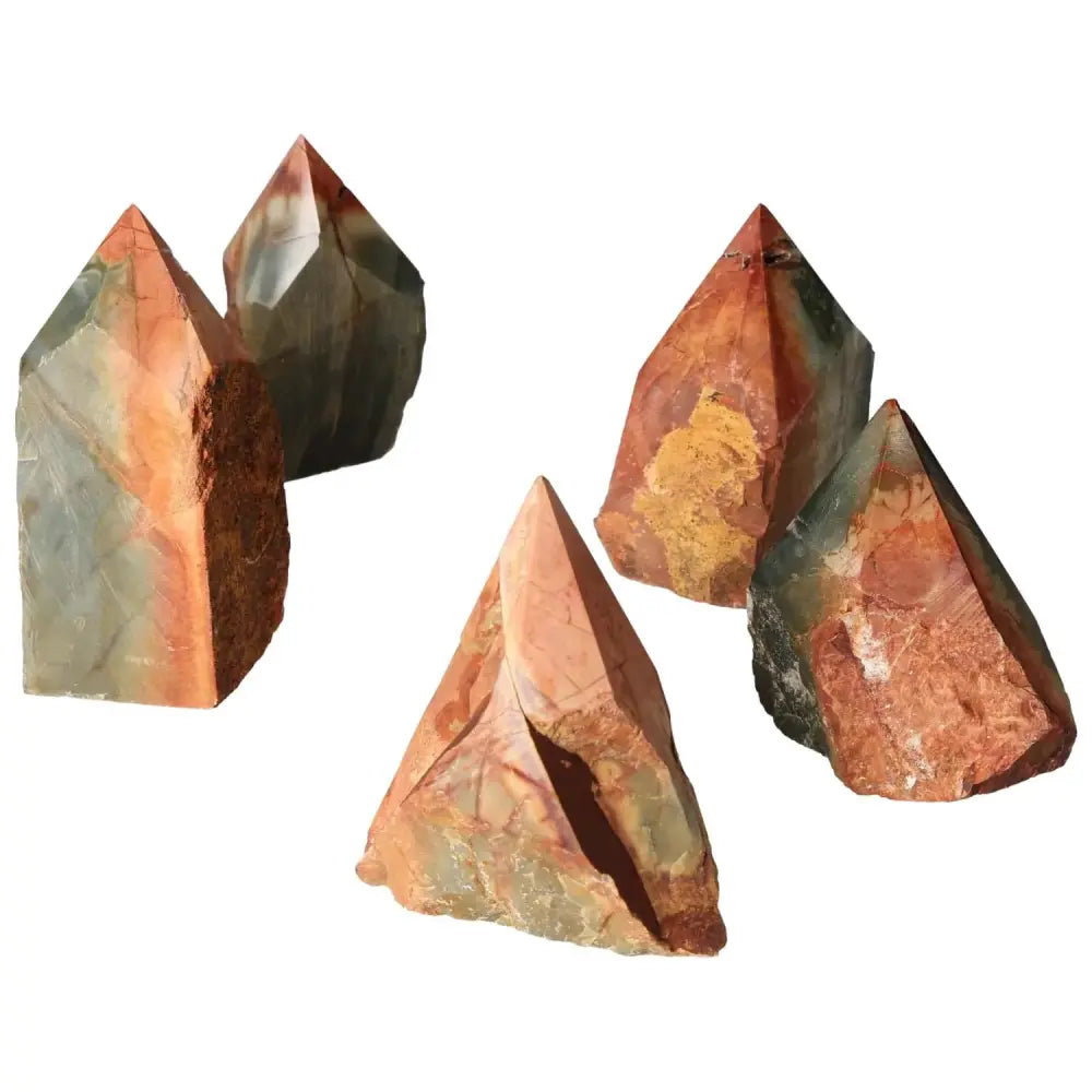 Polished Point Polychrome Jasper crystals displaying vibrant colors like red, orange, and green, known for their spiritual energy.