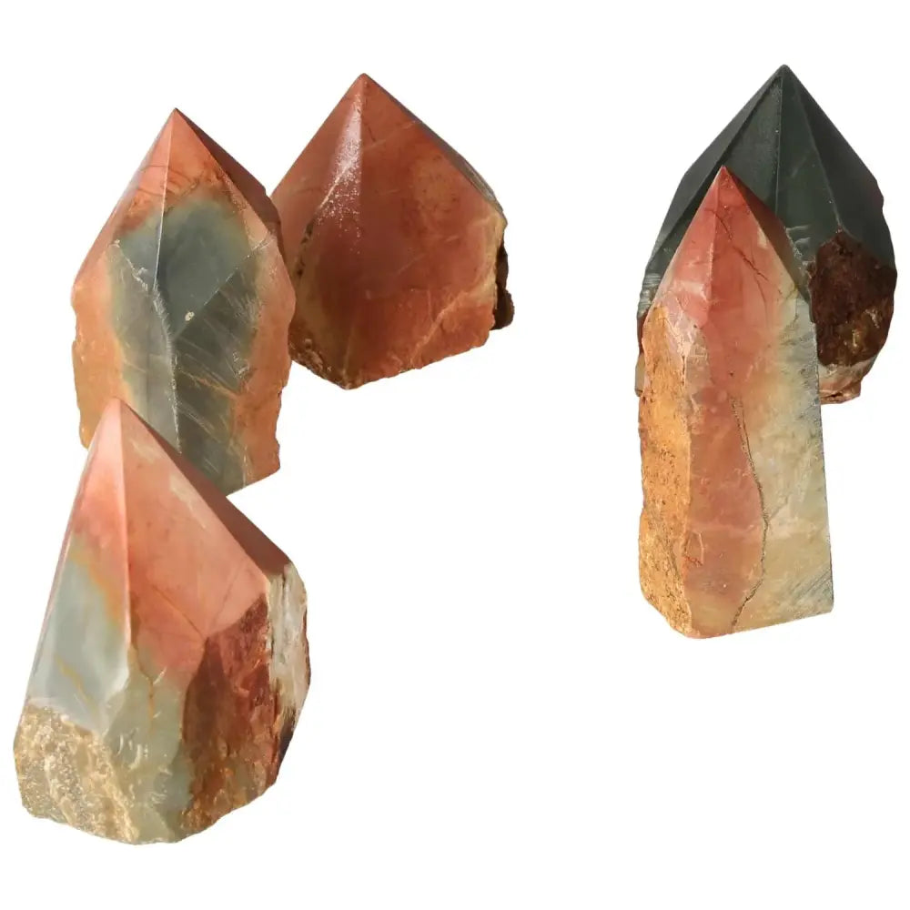 Polished Point Polychrome Jasper stones showcasing vibrant colors like red, orange, and green, known for grounding and energizing effects.