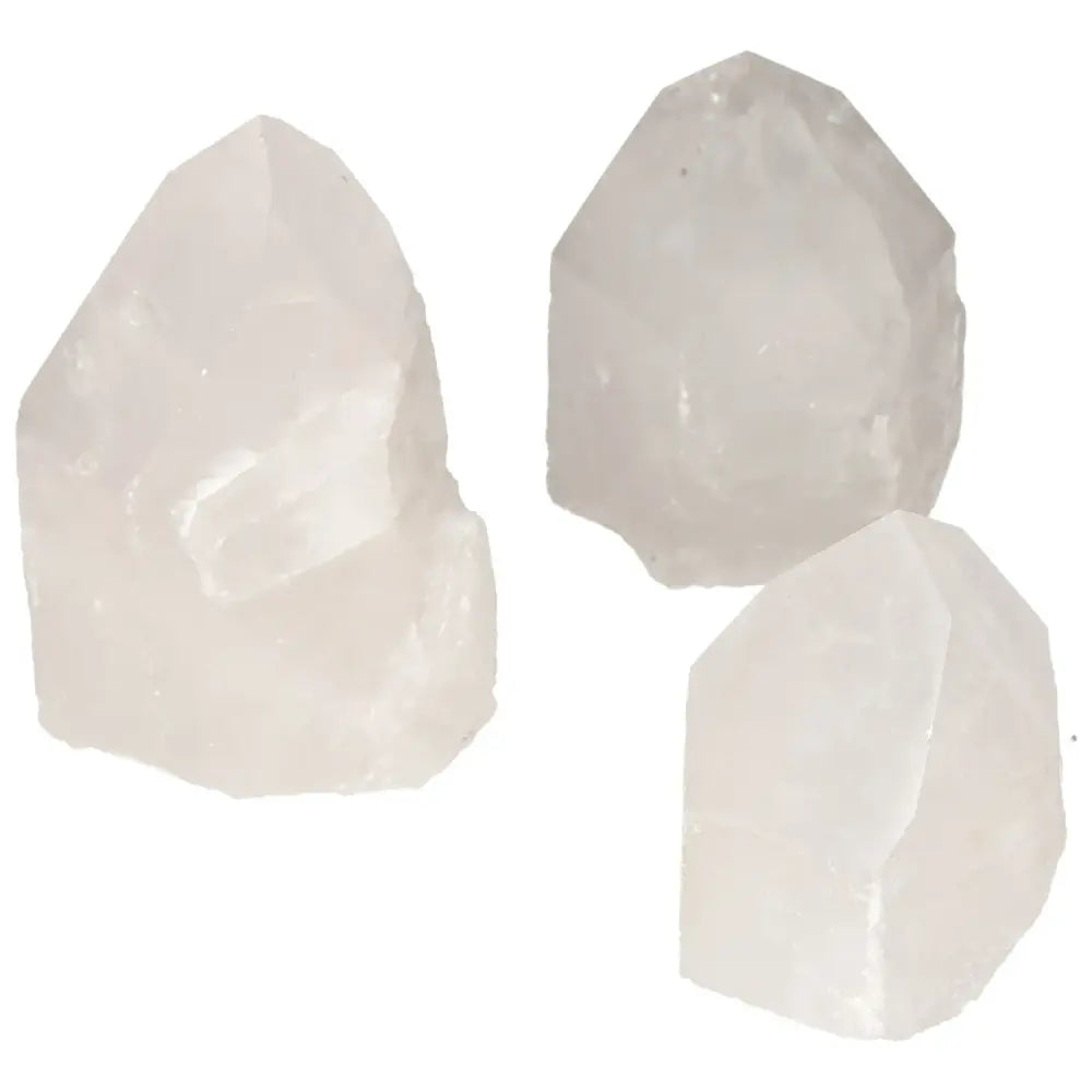 Three polished point quartz crystals from Sylvia Crystals, promoting luxury and spiritual harmony. Ideal for personal transformation.