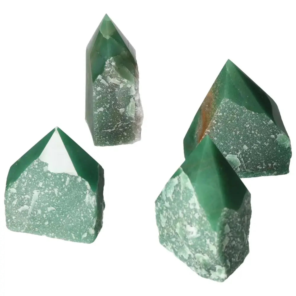 Collection of green polished point quartz crystals, showcasing their natural beauty and superior clarity.