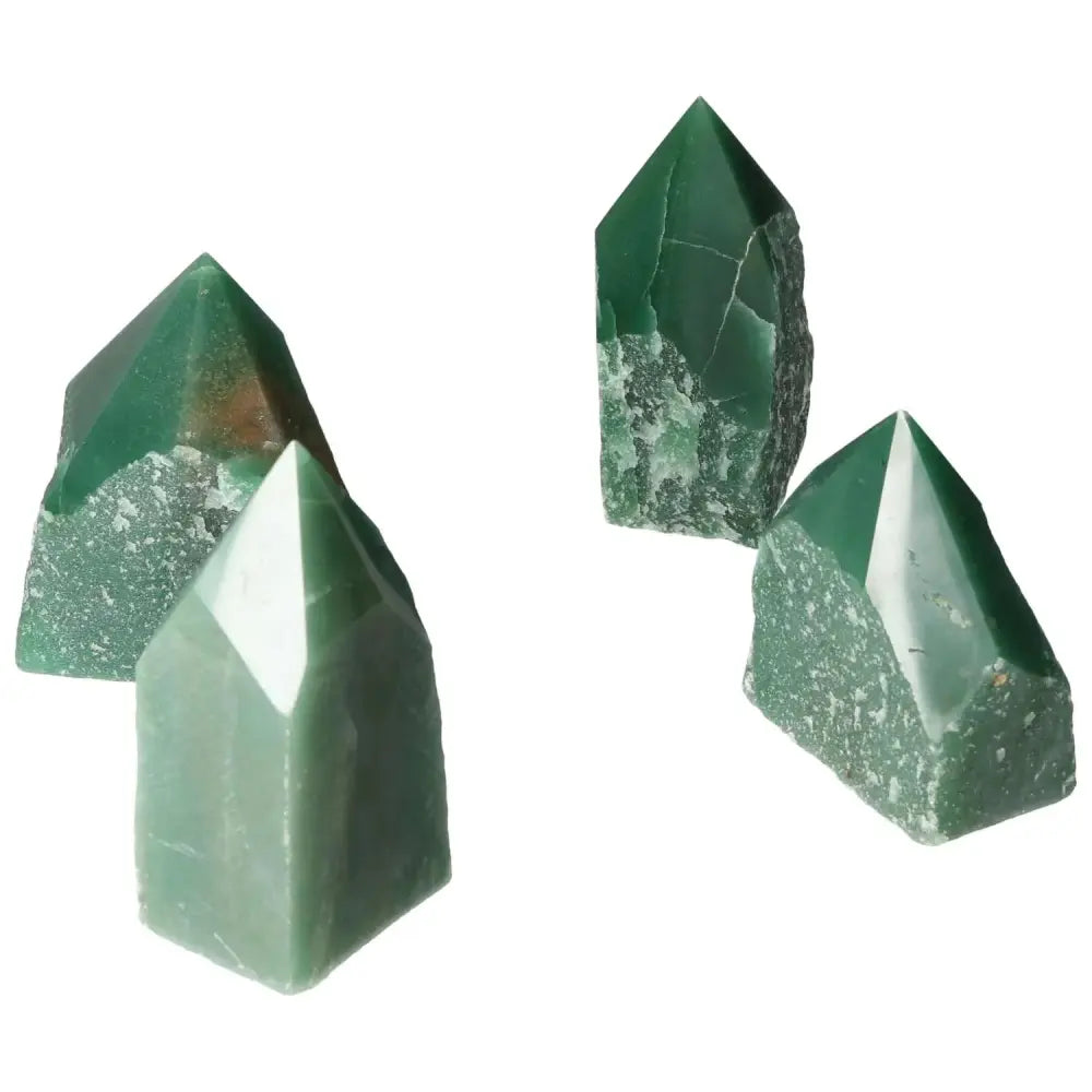 Four polished point quartz crystals in green hues, showcasing superior clarity and natural beauty from Sylvia Crystals.