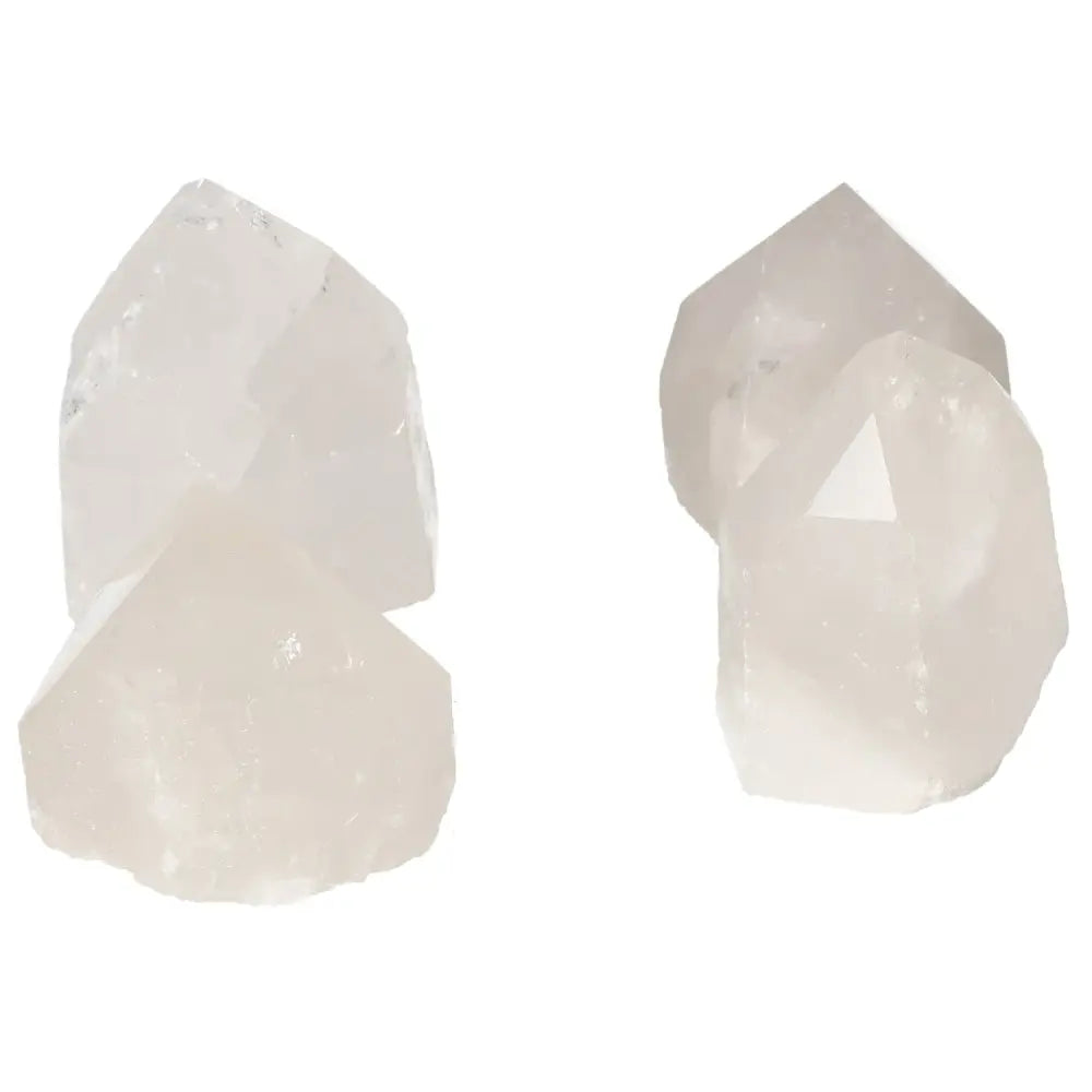 Four polished quartz crystals showcased for luxury and spiritual enhancement by Sylvia Crystals.