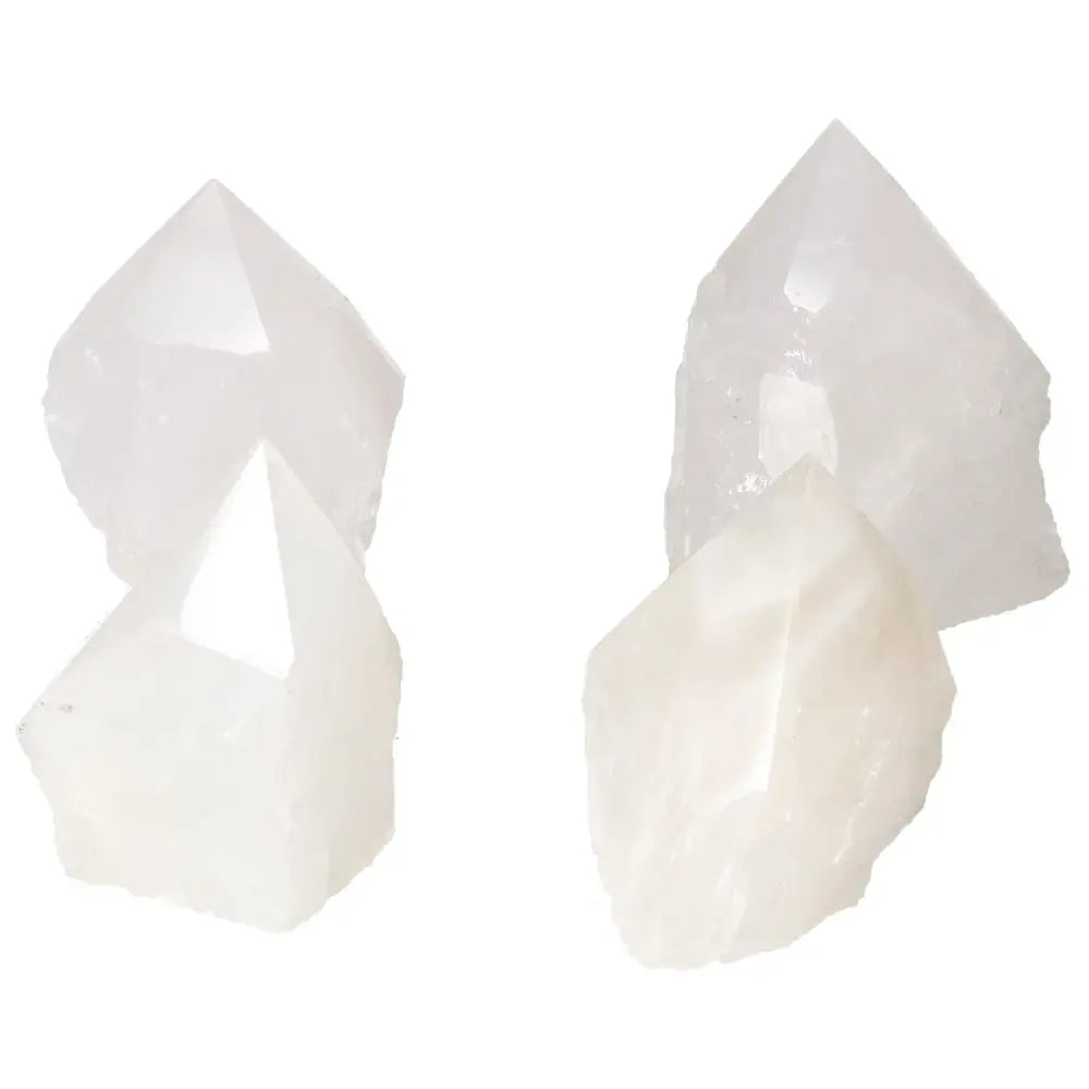Polished Point Quartz M crystals by Sylvia Crystals showcasing purity and strength, ideal for enhancing well-being and serene spaces.