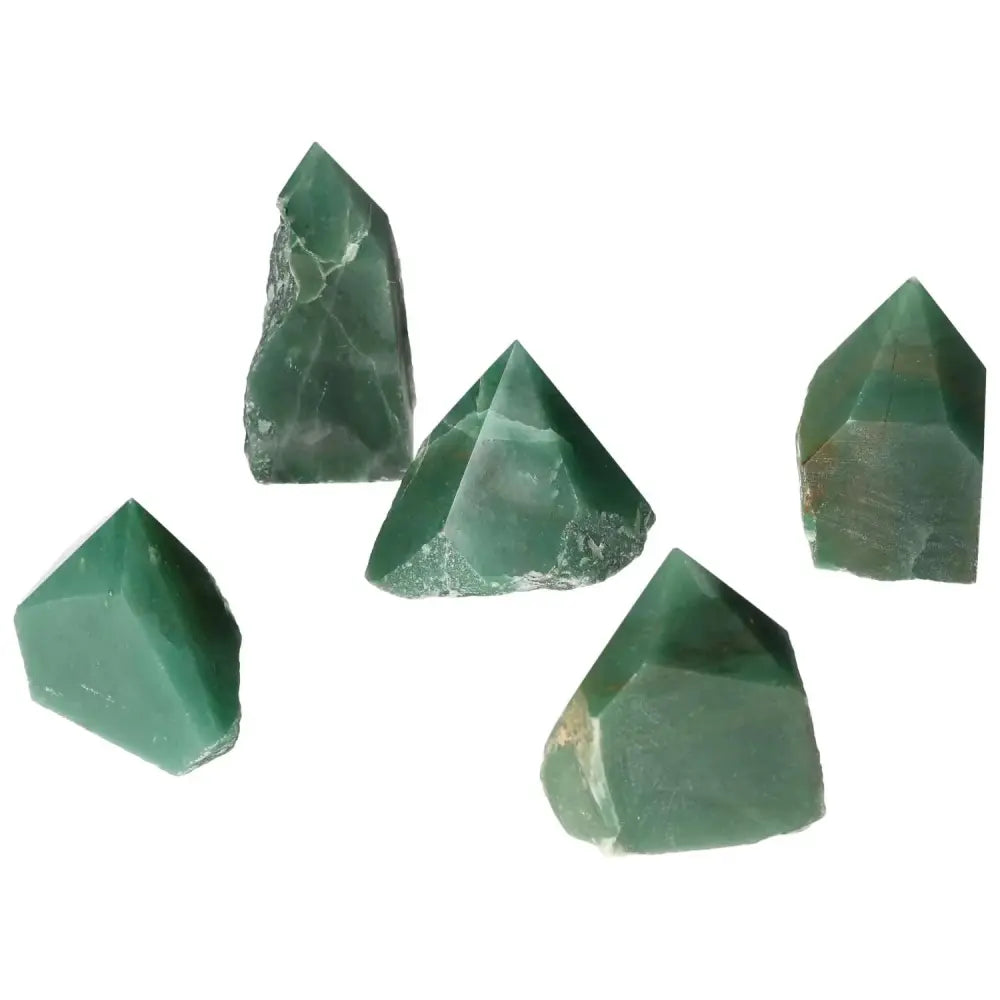 Collection of polished point quartz crystals, showcasing natural clarity and brilliance, ideal for decor enhancement.