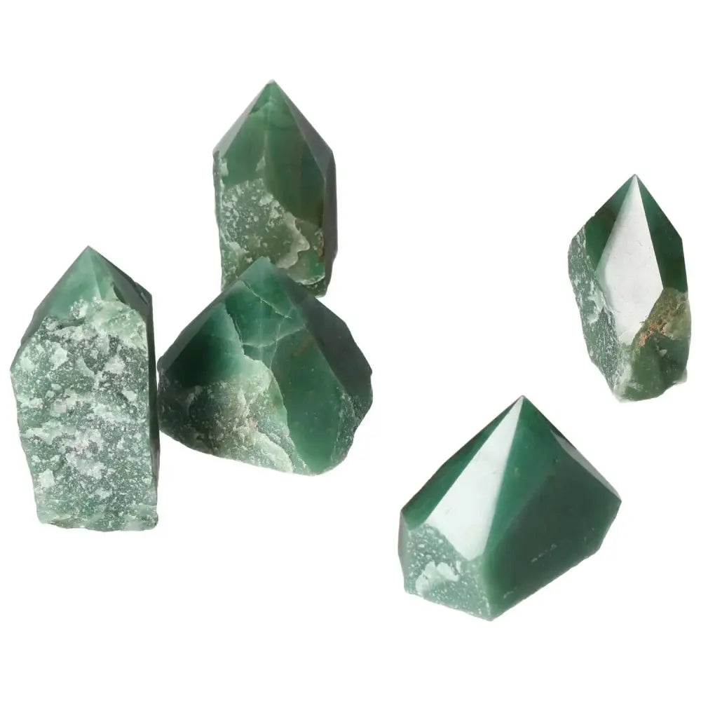 Collection of polished green quartz points from Sylvia Crystals, showcasing natural clarity and brilliance.