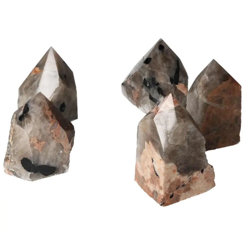 Polished Point Quartz with Tourmaline inclusions from Sylvia Crystals, showcasing unique clear quartz and black tourmaline patterns.