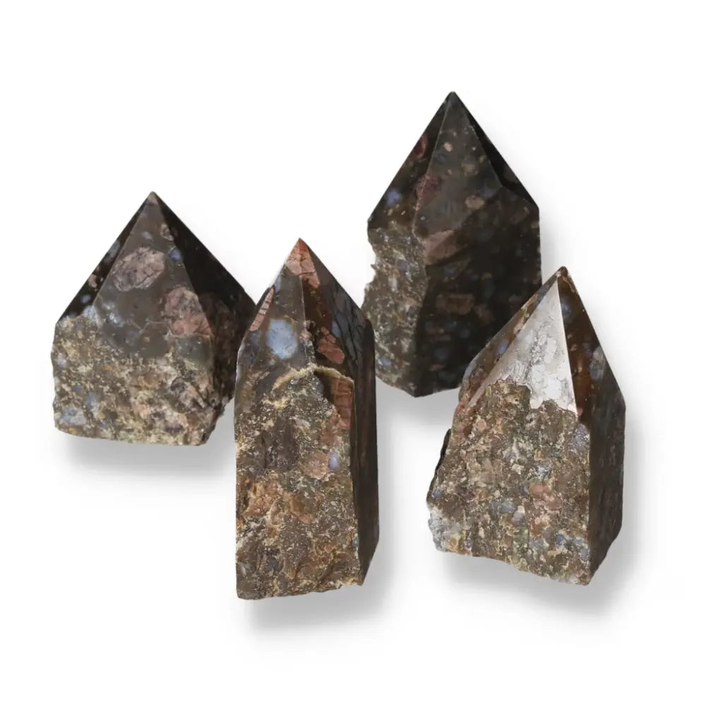 Polished Point Rhyolite M crystals with unique quartz and feldspar patterns, featuring speckles and banding in pink, green, brown, gray.