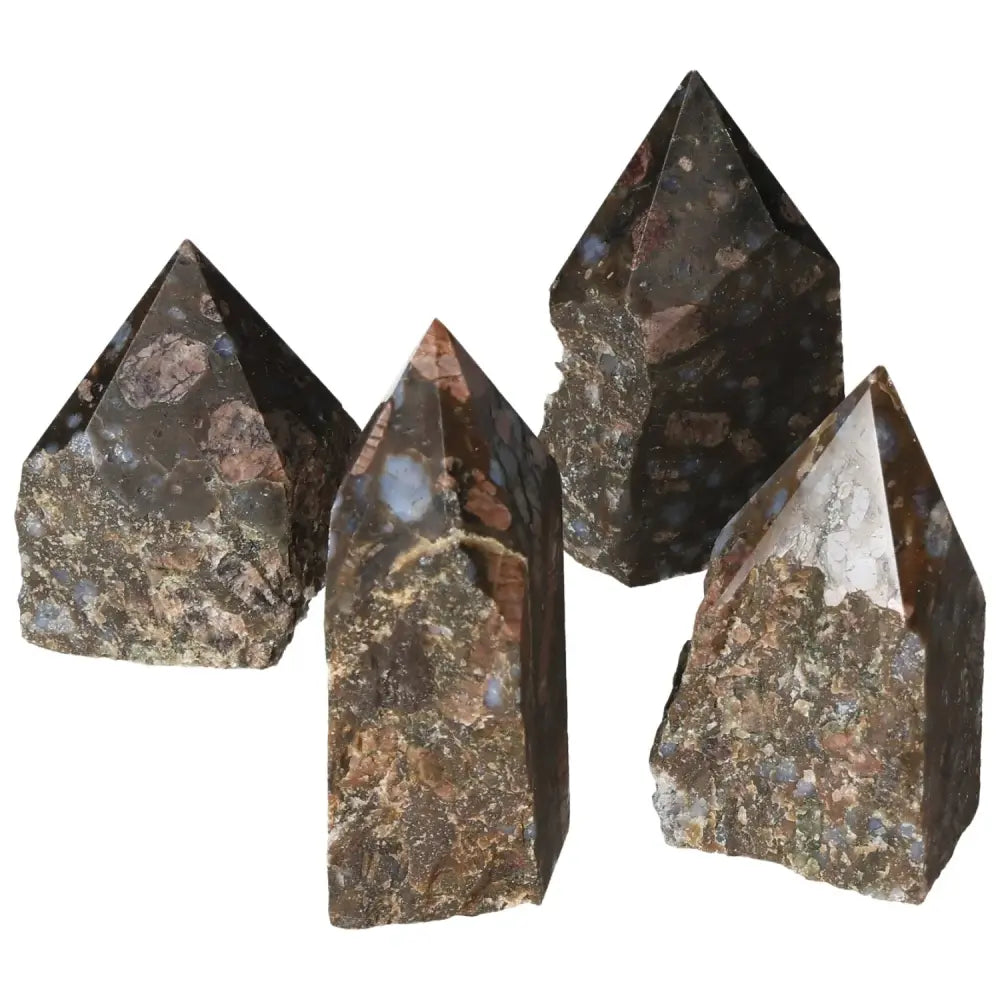Polished Point Rhyolite M crystals with unique quartz and feldspar speckles and banding in natural pink, green, brown, and gray hues.