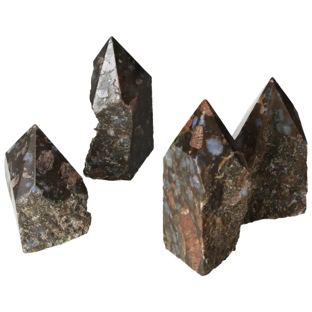 Polished Point Rhyolite M crystals with pink, green, brown, and gray speckles, showcasing unique quartz and feldspar patterns.