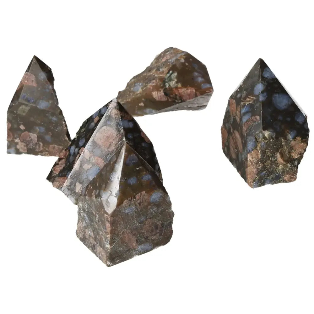 Polished Point Rhyolite S crystals, showcasing vibrant pink, green, brown, and gray hues, from Sylvia Crystals collection.