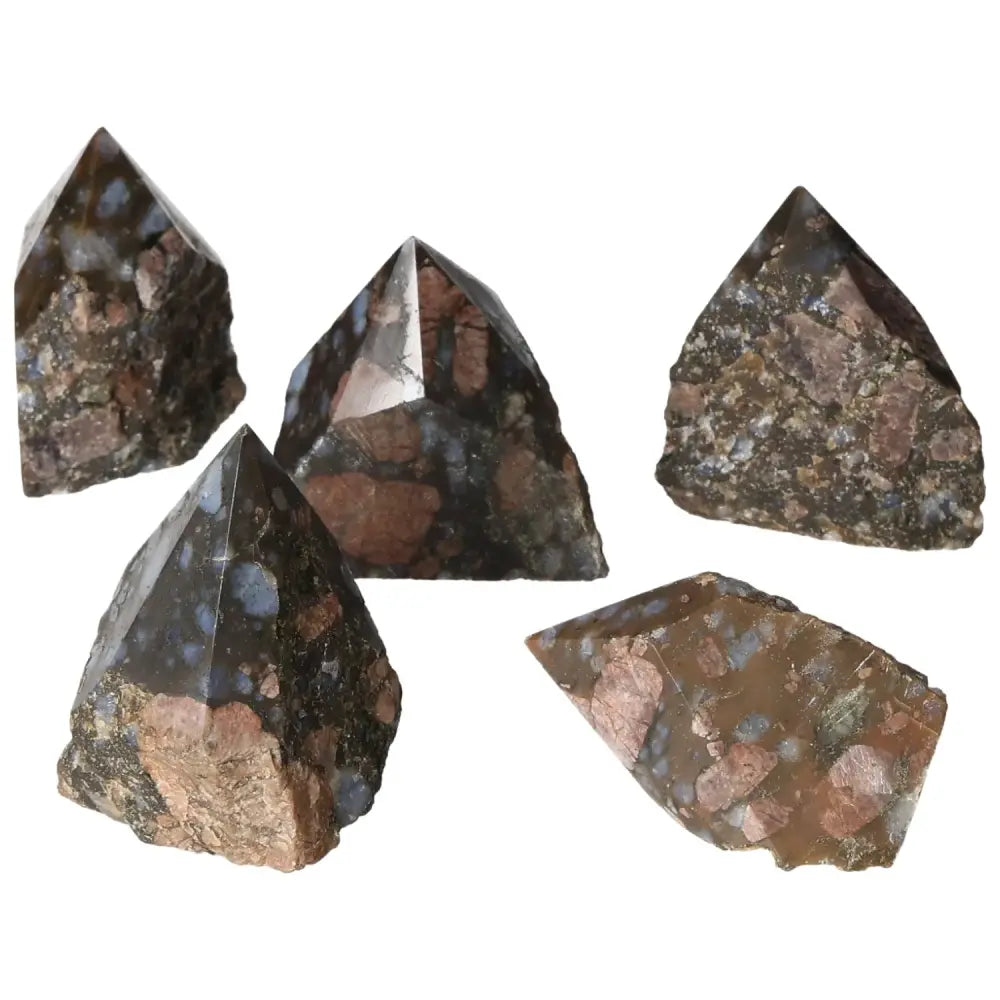 Polished Point Rhyolite S crystals displaying pink, green, and brown hues, handcrafted and sourced by Sylvia Crystals.