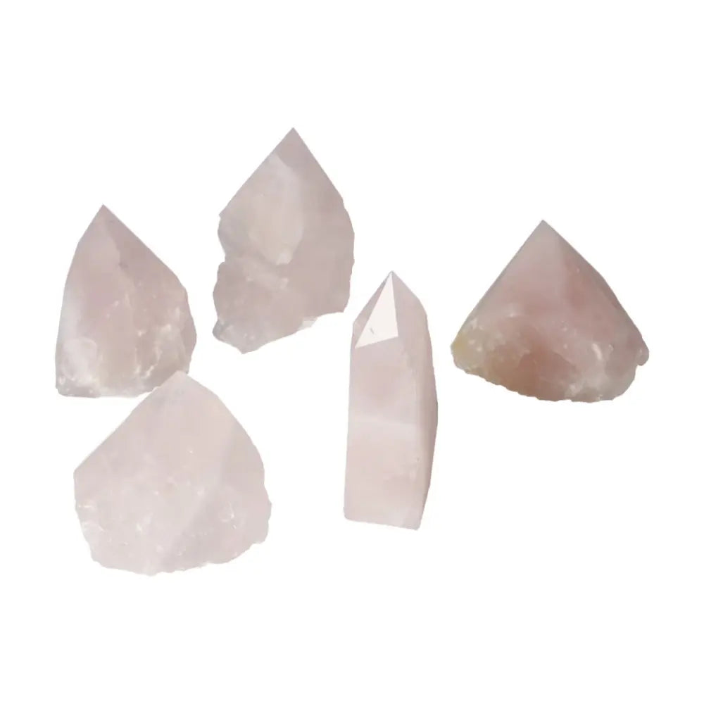 Polished Point Rose Quartz crystals set against a white backdrop, showcasing luxury and spiritual elegance for inner peace enhancement.