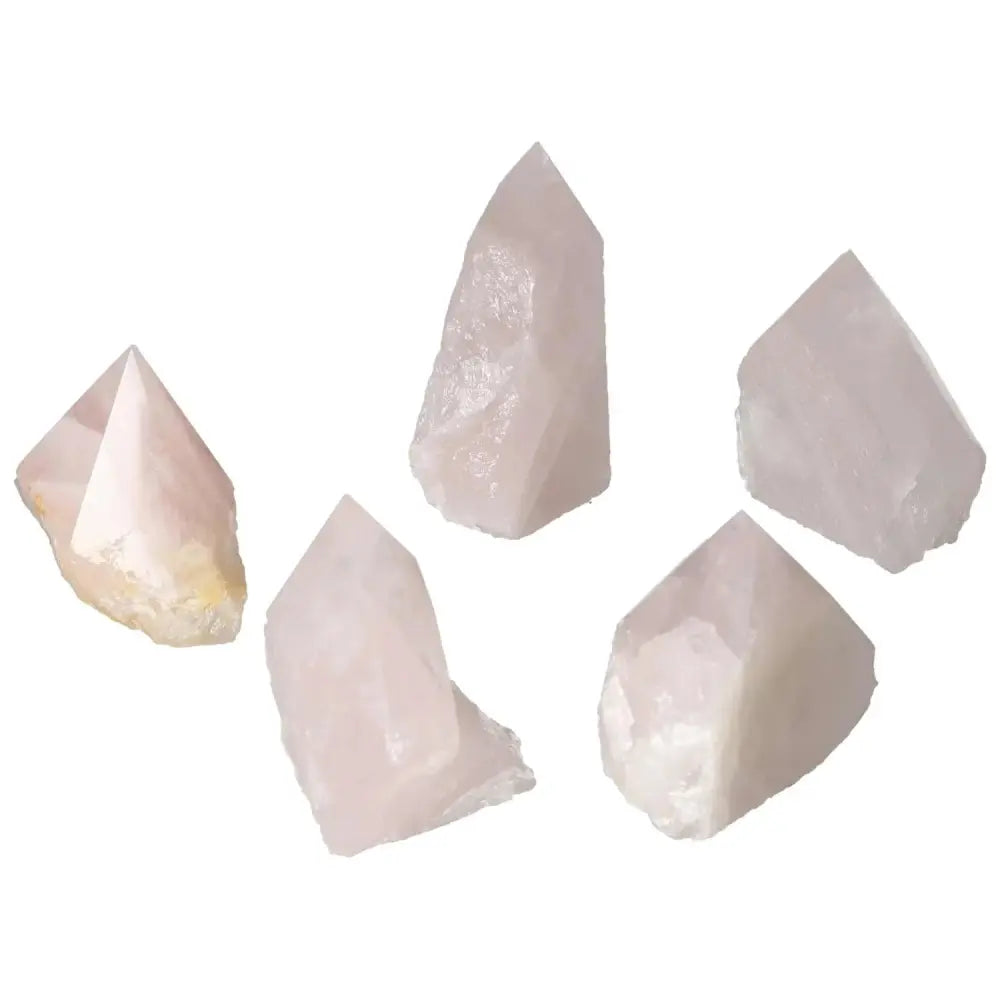 Collection of Polished Point Rose Quartz crystals showcasing their natural beauty and soft pink hues, ideal for spiritual enhancements.