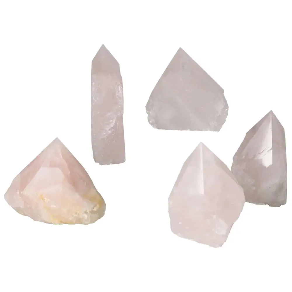 Collection of polished rose quartz points in various shapes, showcasing luxury and elegance, perfect for enhancing spiritual connection.