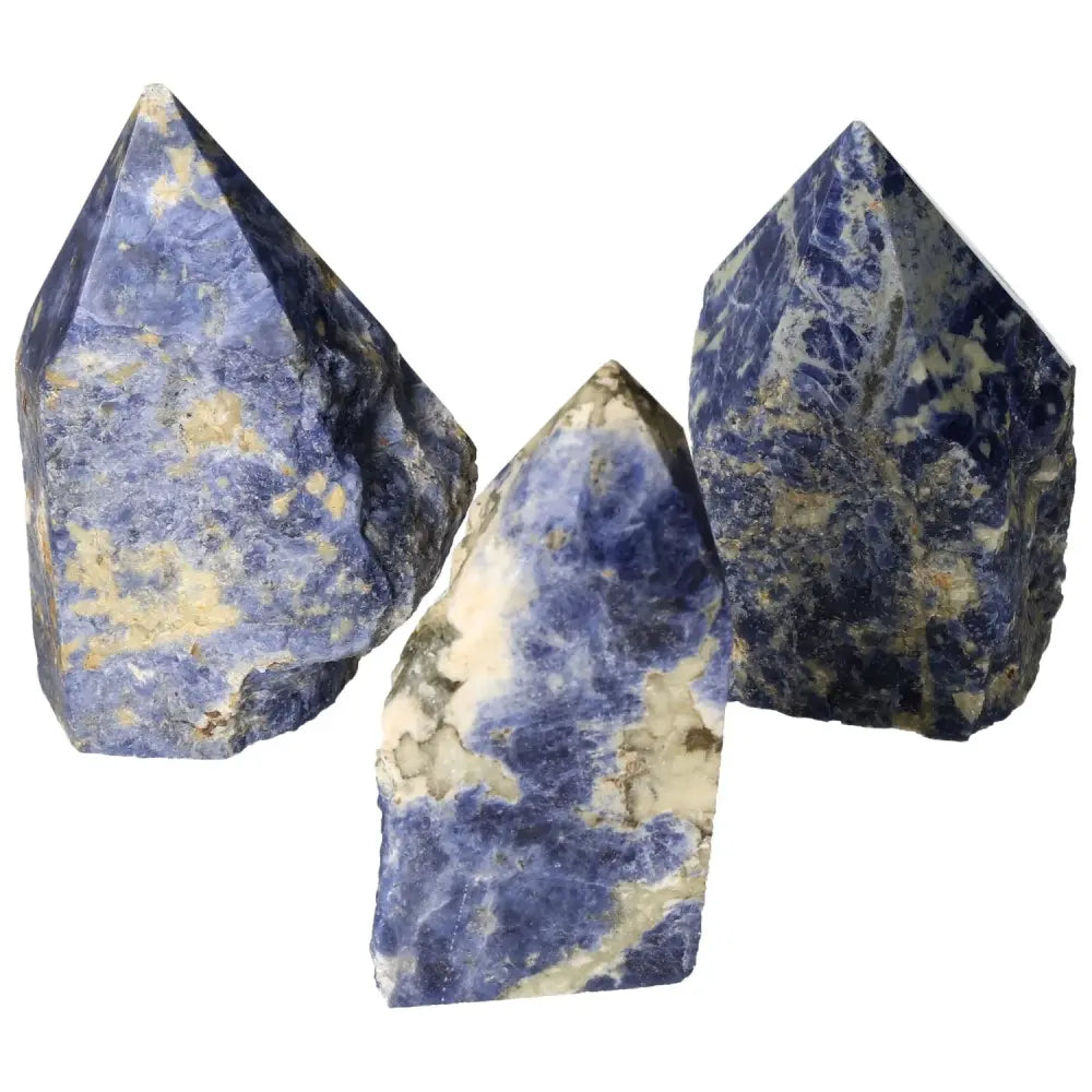 Polished Point Sodalite L stones showcasing natural blue hues, crafted by Sylvia Crystals to enhance creativity and clarity of thought.