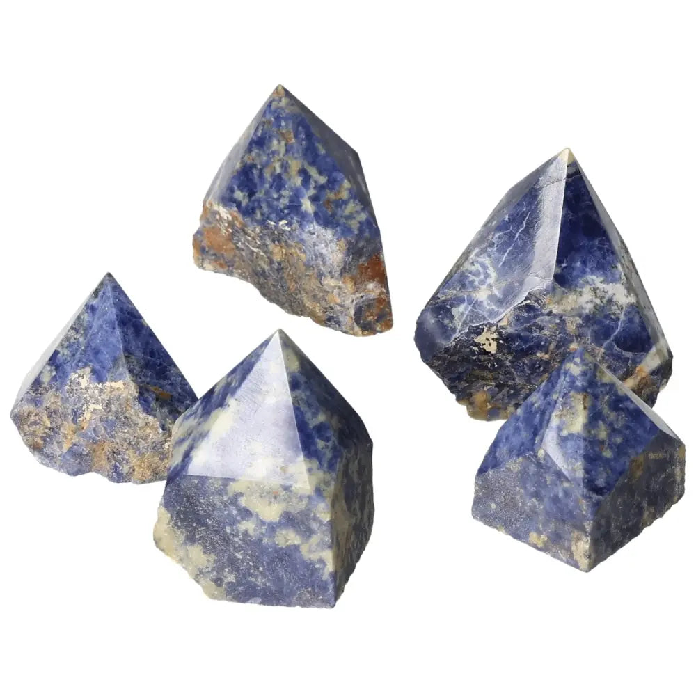 Group of polished sodalite crystal points displaying deep blue hues and natural texture, ideal for enhancing mental clarity and creativity.
