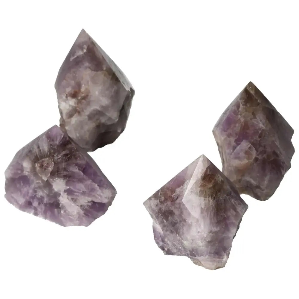 Polished Super Seven Amethyst crystals from Sylvia Crystals, showcasing deep purple hues and intricate patterns for spiritual elegance.