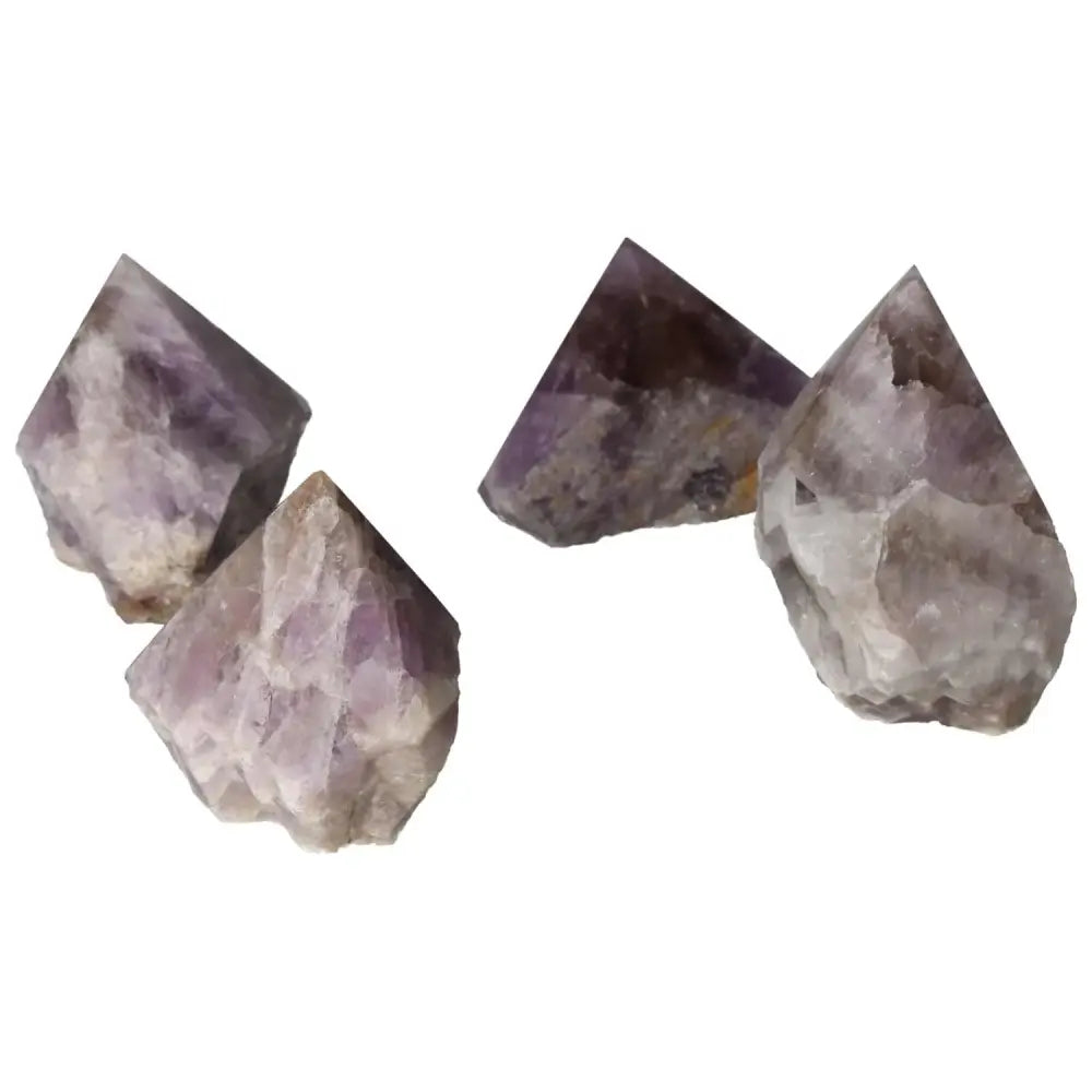 Four polished Super Seven Amethysts displaying their deep purple hue and intricate patterns, enhancing spiritual elegance.