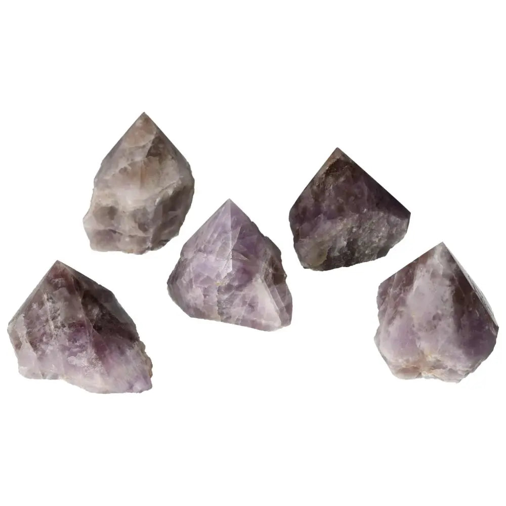 Five polished Super Seven Amethyst crystals from Sylvia Crystals, showcasing unique purple hues and energy-enhancing properties.