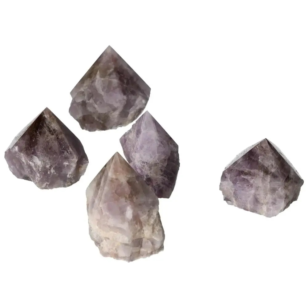Collection of polished Super Seven Amethyst crystals from Sylvia Crystals, known for stress reduction and energy enhancement.