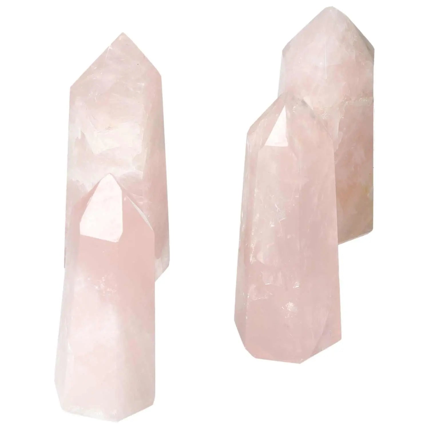 Polished Rose Quartz Obelisks from Sylvia Crystals, known for gentle energy and luxury, pink quartz radiating soft, soothing hues.