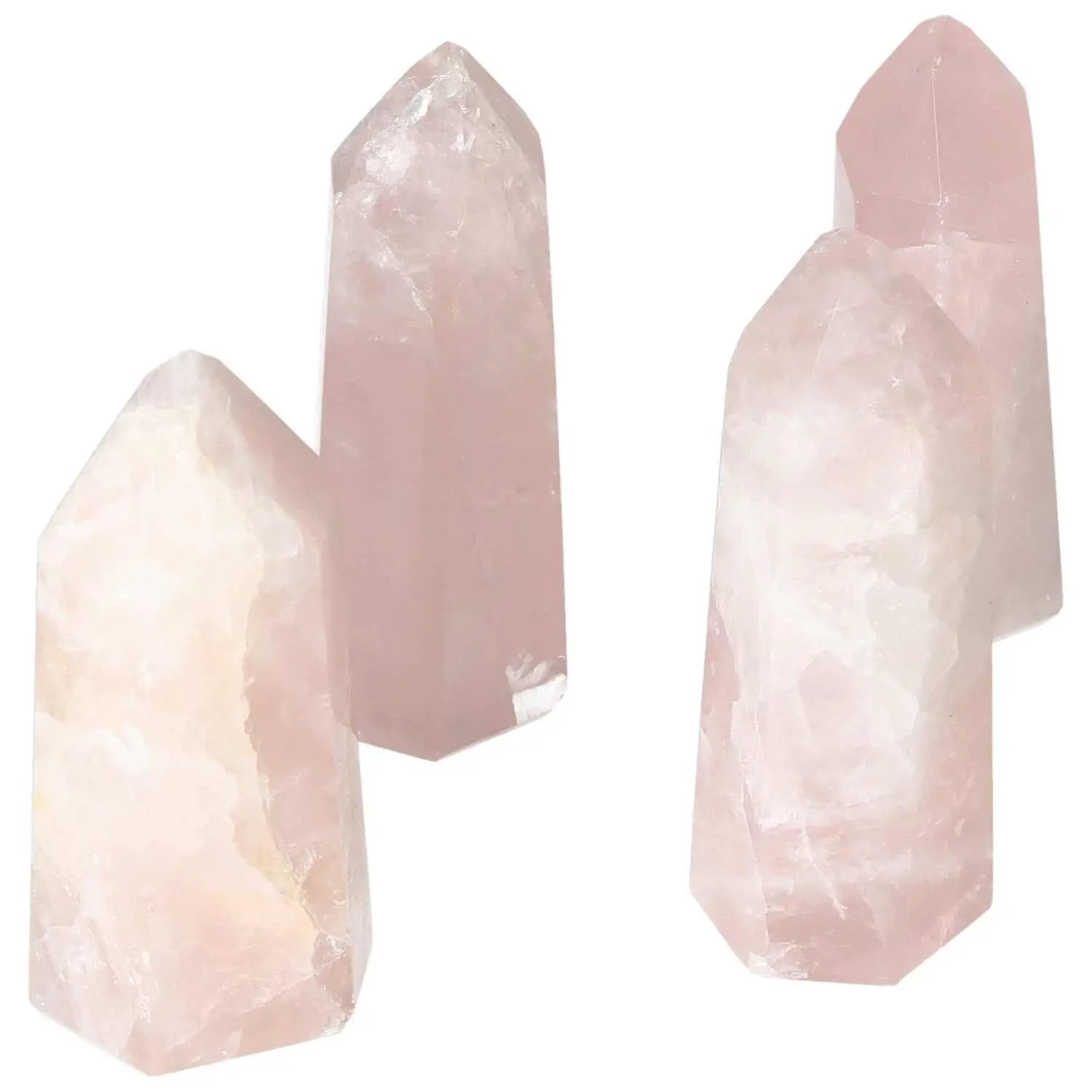 Elegant polished rose quartz obelisks showcasing soft pink hues, perfect for luxury and spiritual collection from Sylvia Crystals.