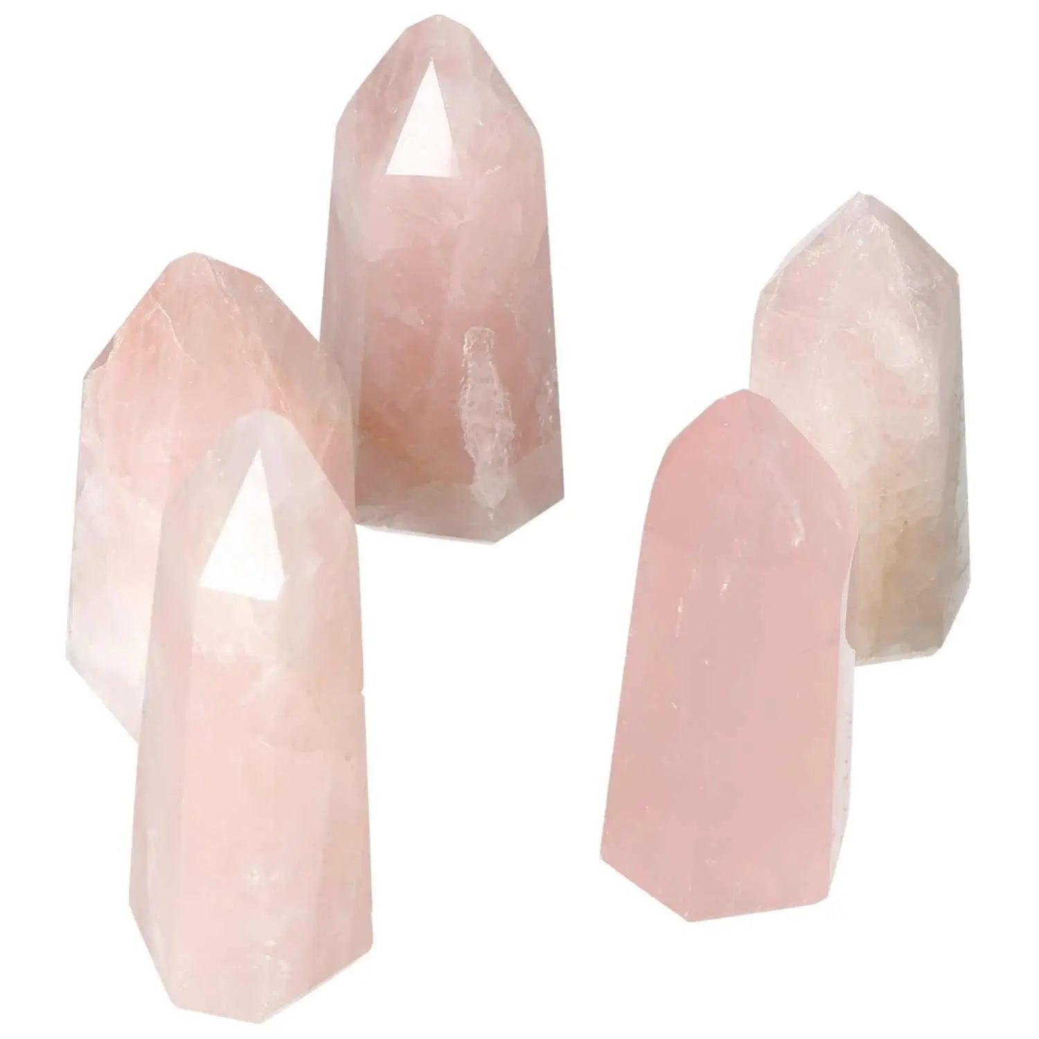 Five polished rose quartz obelisks from Sylvia Crystals showcasing gentle pink hues and high-quality craftsmanship.