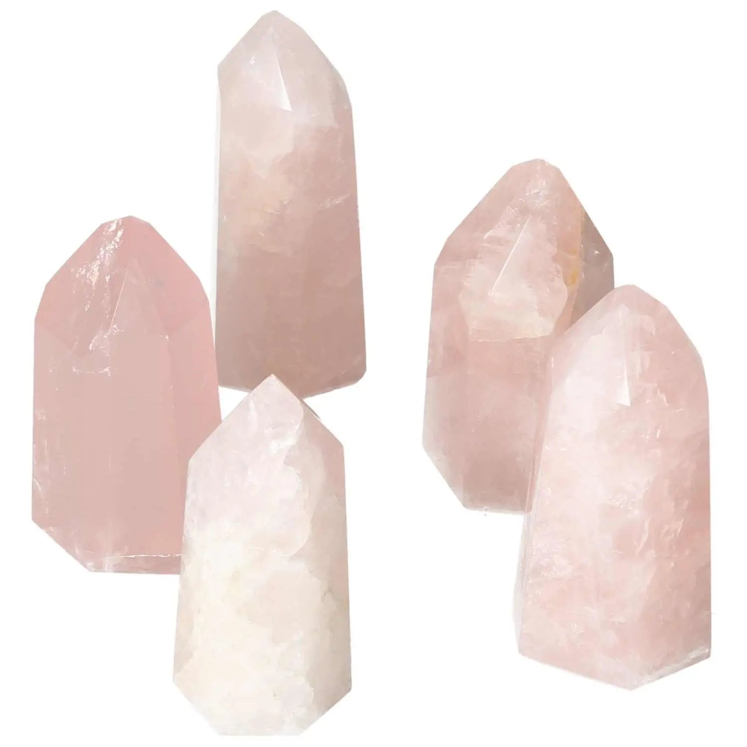 Polished rose quartz obelisks radiating soft pink hues, symbolizing love and tranquility, from Sylvia Crystals collection.