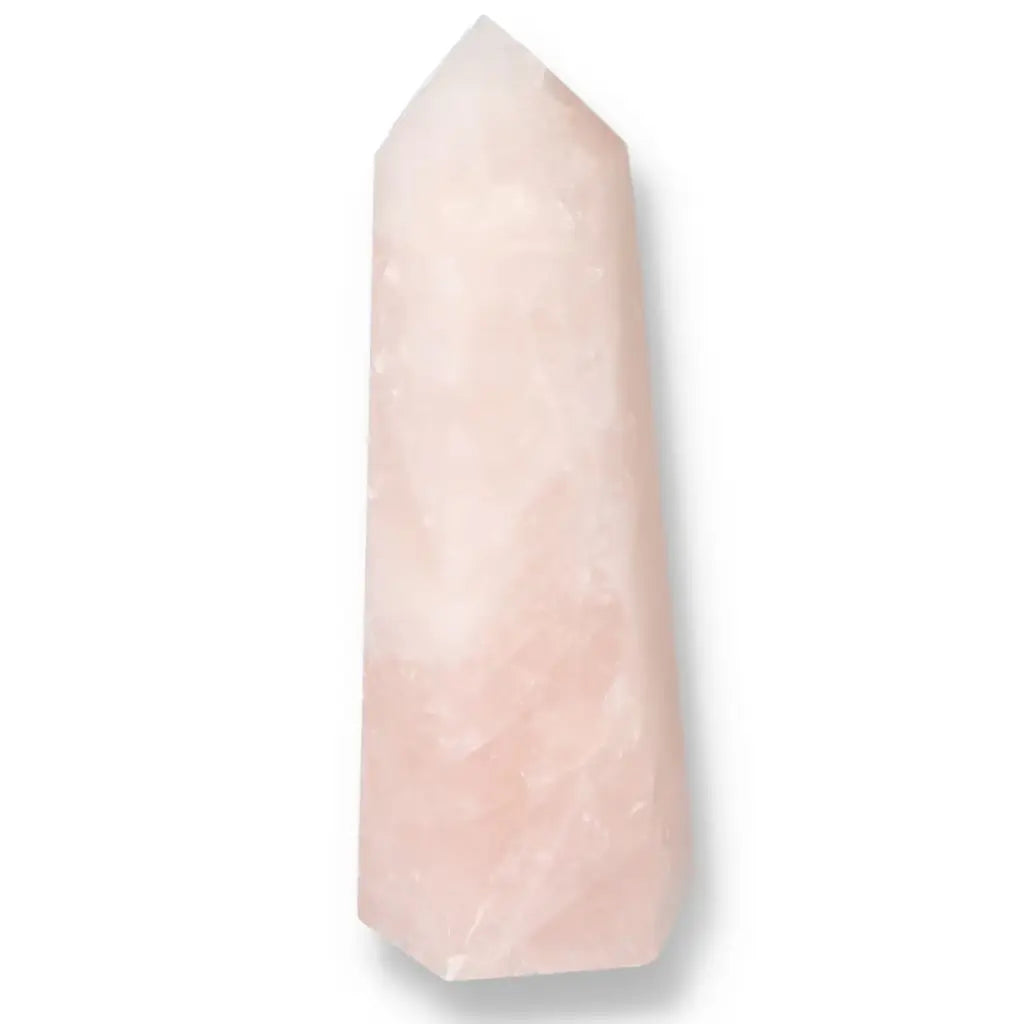 Polished pink quartz obelisk from Sylvia Crystals, showcasing luxury and spirituality with its soft hue and flawless finish.