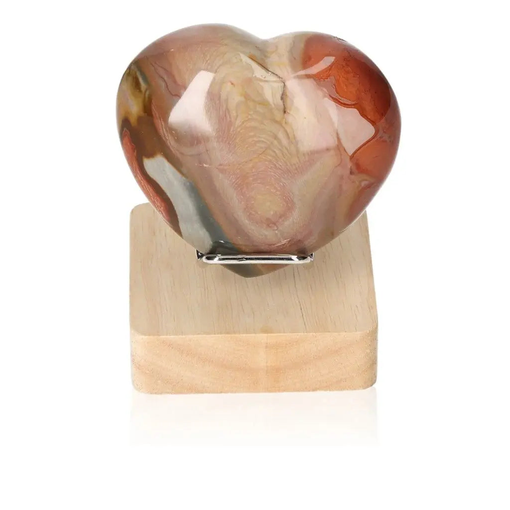 Polychrome Jasper Heart displaying vibrant earthy colors, showcasing nature's artistry on a wooden stand.