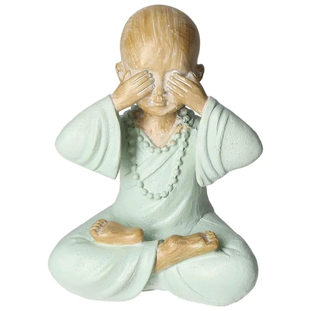 Serene monk sculpture in meditation, crafted from poly by Sylvia Crystals, symbolizing tranquility and luxury.
