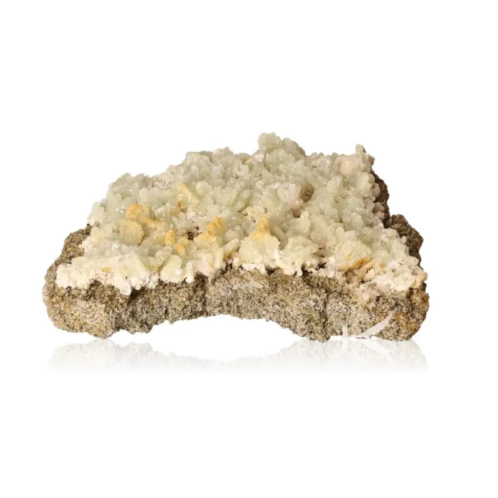 Prehnite Druze gemstone showcasing pale green, translucent crystals, known for promoting inner peace and spiritual growth.