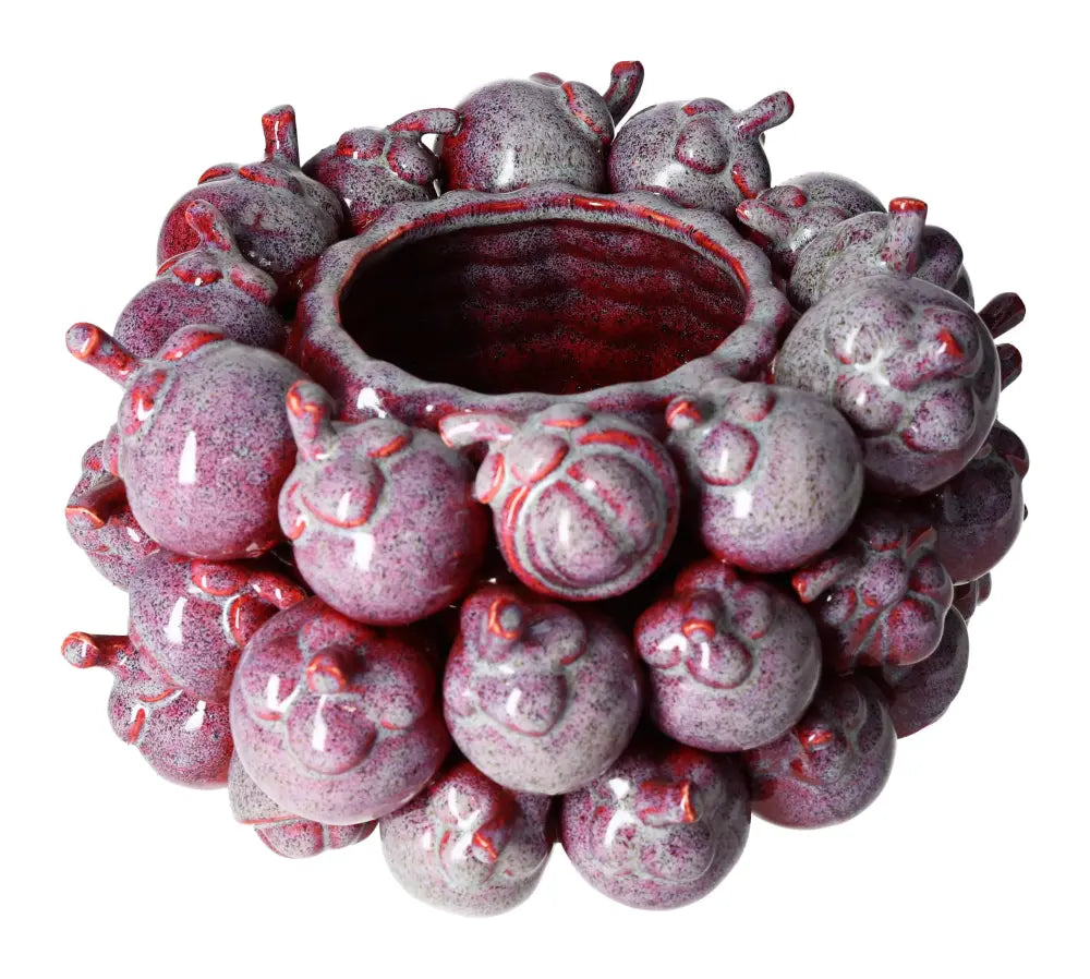 Purple earthenware flower pot with unique textured design, ideal for enhancing tranquil spaces with elegance and mindfulness.
