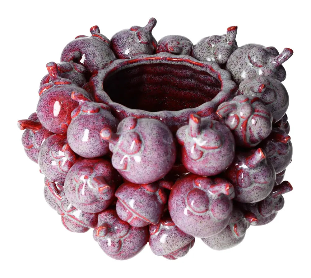 Unique purple earthenware pot with artistic design, perfect for enhancing home decor and adding a touch of elegant style.