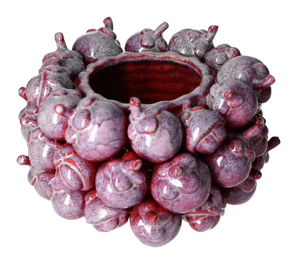 Unique purple earthenware flower pot with textured design, ideal for enhancing home decor with elegance and tranquility.